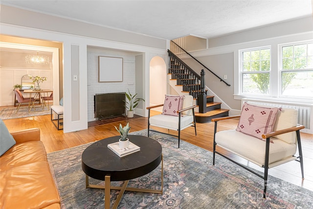 118 Macon Ave, Asheville, NC 28801 - living area featuring stairs, wood finished floors, a fireplace, and baseboards