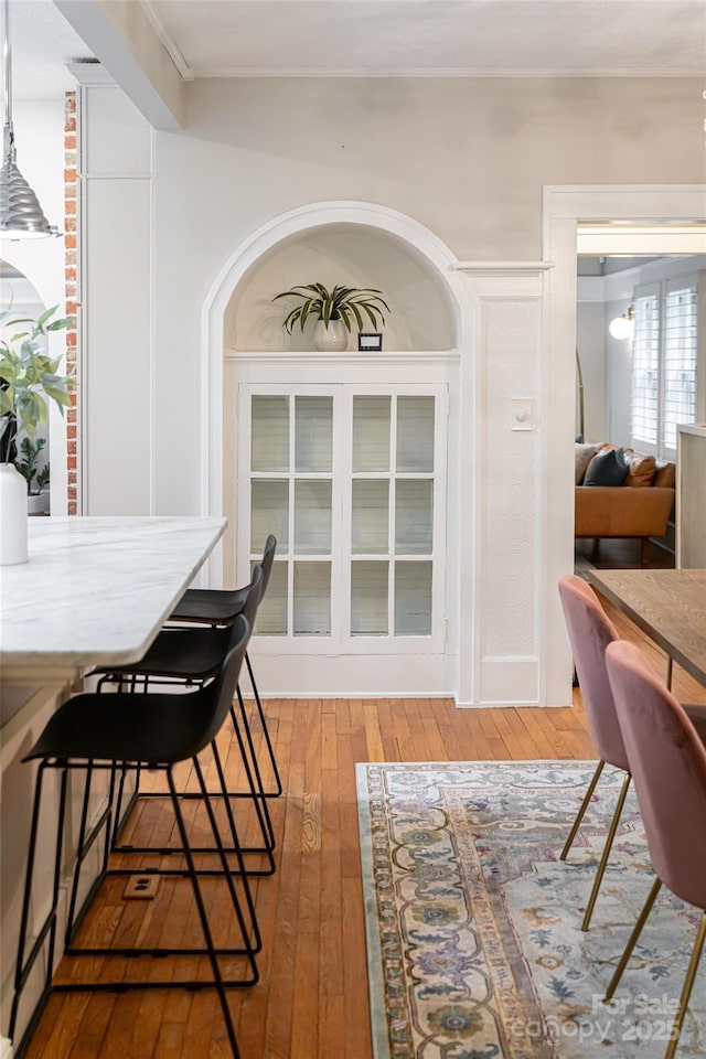 118 Macon Ave, Asheville, NC 28801 - dining room with light wood-style floors and arched walkways