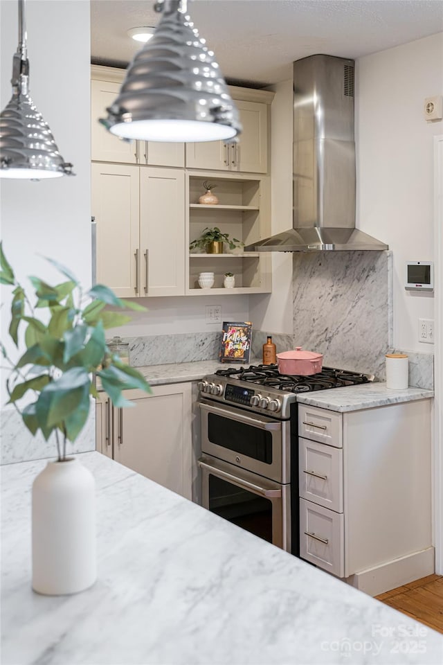 118 Macon Ave, Asheville, NC 28801 - kitchen featuring wall chimney exhaust hood, double oven range, decorative backsplash, open shelves, and light stone counters