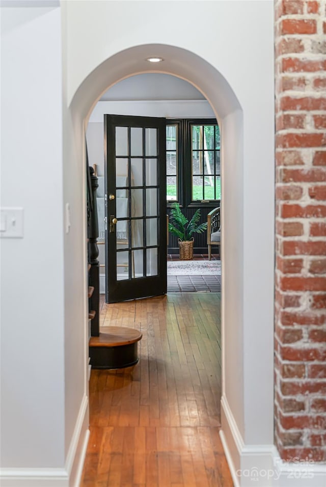 118 Macon Ave, Asheville, NC 28801 - hall featuring hardwood / wood-style flooring, arched walkways, and baseboards
