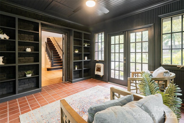 118 Macon Ave, Asheville, NC 28801 - entryway featuring tile patterned floors, heating unit, ceiling fan, crown molding, and built in shelves