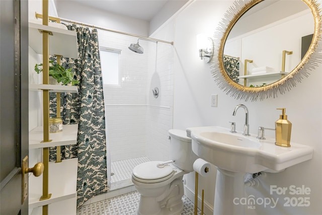 118 Macon Ave, Asheville, NC 28801 - bathroom featuring toilet, a stall shower, tile patterned floors, and baseboards
