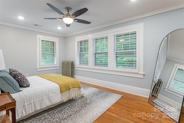118 Macon Ave, Asheville, NC 28801 - bedroom with wood finished floors, crown molding, baseboards, radiator, and recessed lighting