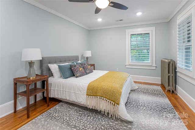 118 Macon Ave, Asheville, NC 28801 - bedroom featuring radiator, wood finished floors, ornamental molding, baseboards, and a ceiling fan