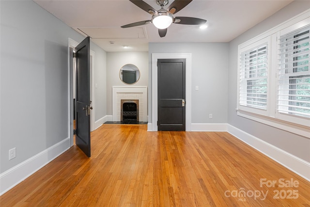 118 Macon Ave, Asheville, NC 28801 - unfurnished living room with baseboards, light wood finished floors, and a ceiling fan