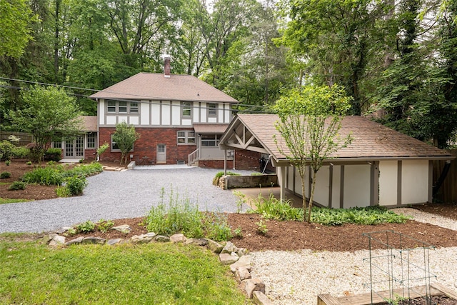 118 Macon Ave, Asheville, NC 28801 - rear view of property featuring a chimney, french doors, brick siding, view of scattered trees, and a shingled roof