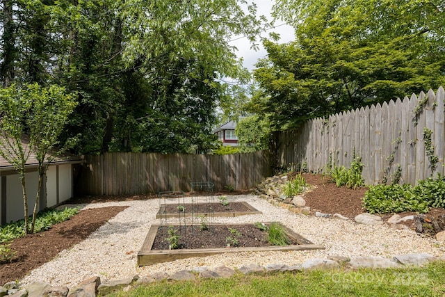 118 Macon Ave, Asheville, NC 28801 - fenced backyard with a vegetable garden