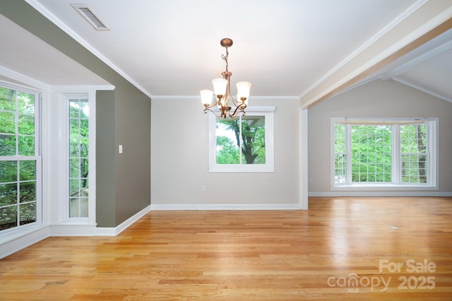 200 Allen Mountain Dr, Black Mountain, NC 28711 - empty room featuring a chandelier, healthy amount of natural light, light wood-style floors, baseboards, and crown molding
