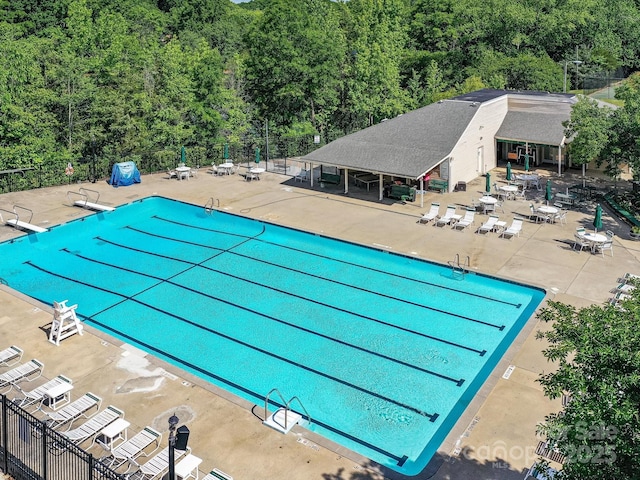 2315 Lawton Bluff Rd, Charlotte, NC 28226 - community pool featuring a patio area and a forest view