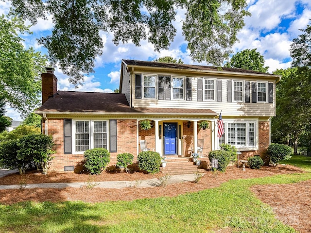 2315 Lawton Bluff Rd, Charlotte, NC 28226 - view of front of house with brick siding, a chimney, and crawl space