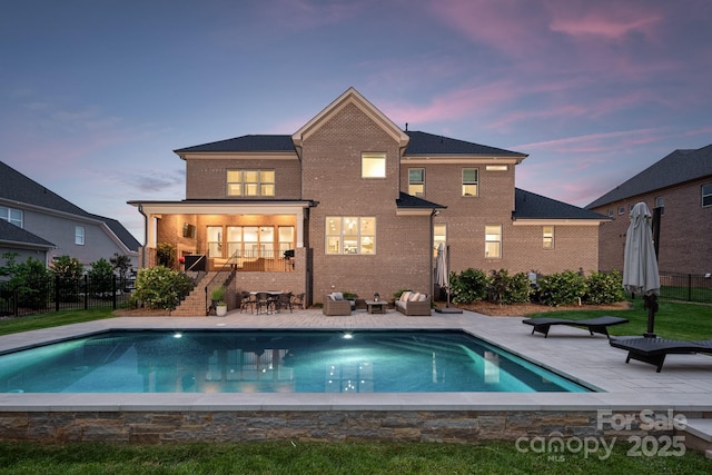 1445 Cherry Laurel Dr, Waxhaw, NC 28173 - rear view of property featuring fence, a patio, and brick siding