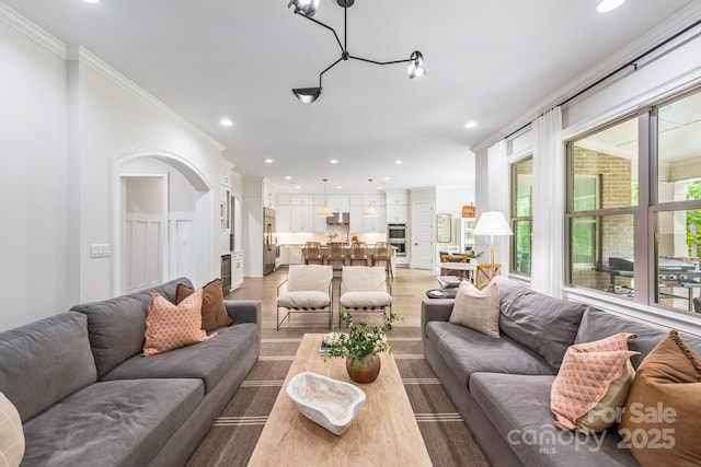 1445 Cherry Laurel Dr, Waxhaw, NC 28173 - living area featuring recessed lighting, ornamental molding, and light wood-style floors