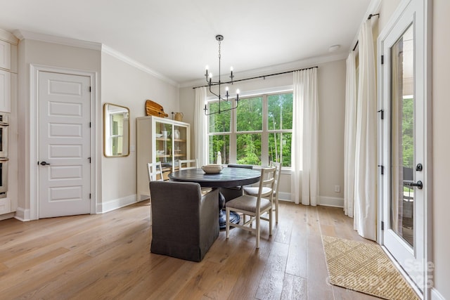 1445 Cherry Laurel Dr, Waxhaw, NC 28173 - dining space with a chandelier, light wood-style floors, baseboards, and ornamental molding