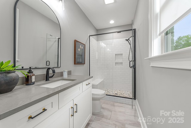 1445 Cherry Laurel Dr, Waxhaw, NC 28173 - full bath with marble finish flooring, a shower stall, toilet, vanity, and baseboards