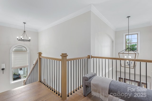 1445 Cherry Laurel Dr, Waxhaw, NC 28173 - hall with a chandelier, an upstairs landing, wood finished floors, and ornamental molding