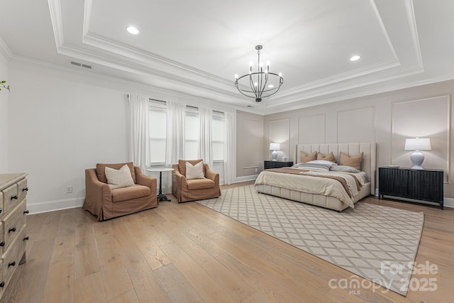 1445 Cherry Laurel Dr, Waxhaw, NC 28173 - bedroom featuring a tray ceiling, a chandelier, crown molding, light wood-type flooring, and recessed lighting