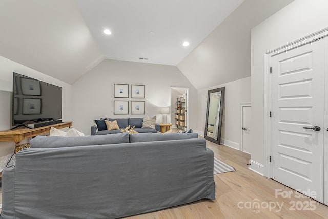1445 Cherry Laurel Dr, Waxhaw, NC 28173 - living area with light wood finished floors, lofted ceiling, baseboards, and recessed lighting
