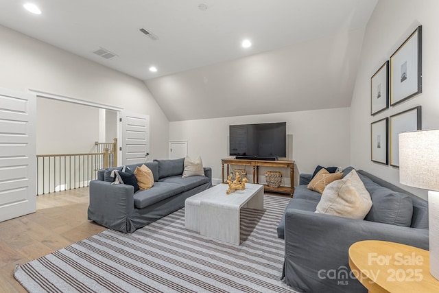 1445 Cherry Laurel Dr, Waxhaw, NC 28173 - living room featuring light wood finished floors, vaulted ceiling, and recessed lighting