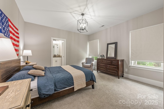 1445 Cherry Laurel Dr, Waxhaw, NC 28173 - bedroom featuring carpet, a chandelier, baseboards, and ensuite bath