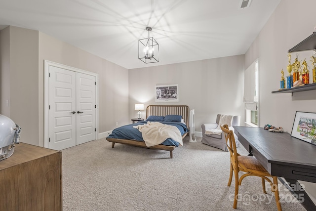 1445 Cherry Laurel Dr, Waxhaw, NC 28173 - bedroom with carpet flooring, a chandelier, and a closet