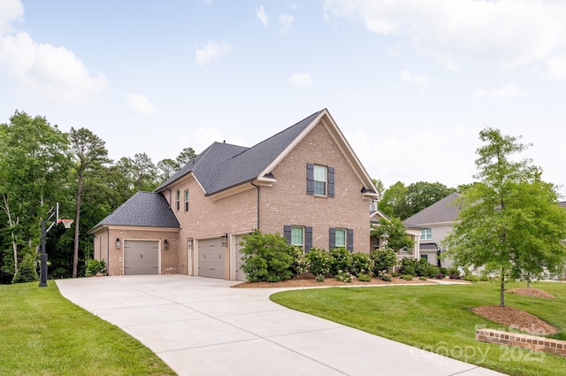 1445 Cherry Laurel Dr, Waxhaw, NC 28173 - traditional-style house with brick siding, driveway, a front yard, an attached garage, and a shingled roof