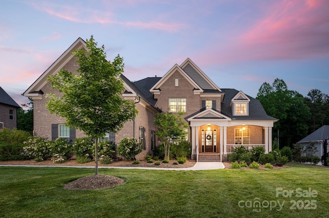 1445 Cherry Laurel Dr, Waxhaw, NC 28173 - view of front of property with brick siding, a yard, and covered porch