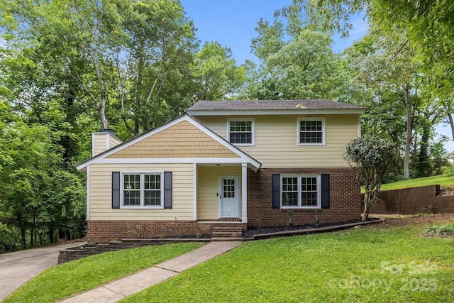 6713 William Harry Ct, Charlotte, NC 28211 - view of front of property with a front lawn, a chimney, and brick siding