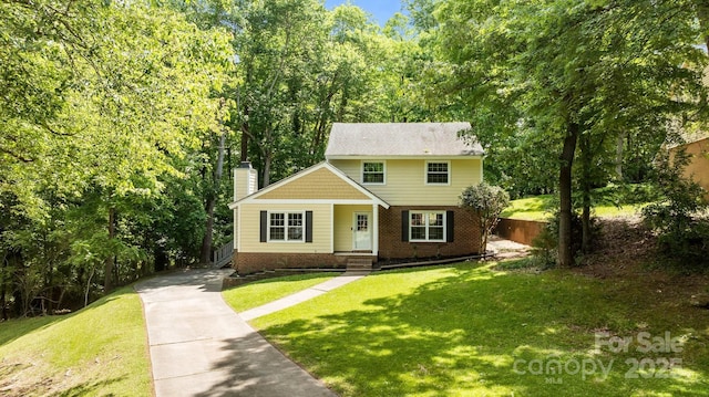 6713 William Harry Ct, Charlotte, NC 28211 - view of front of property featuring a chimney, brick siding, and concrete driveway