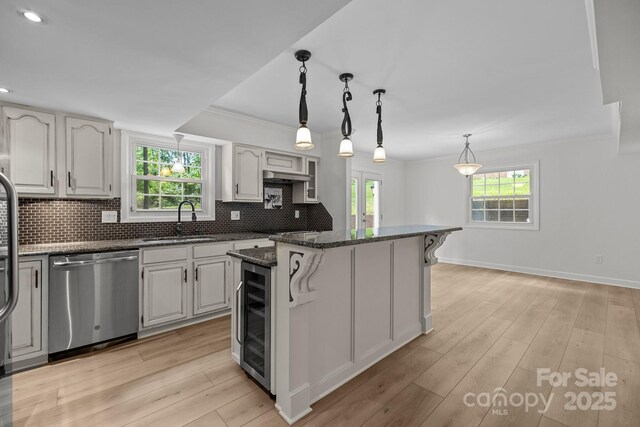 6713 William Harry Ct, Charlotte, NC 28211 - kitchen with dishwasher, a sink, wine cooler, dark stone countertops, and plenty of natural light