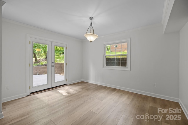 6713 William Harry Ct, Charlotte, NC 28211 - spare room with crown molding, plenty of natural light, french doors, baseboards, and light wood finished floors