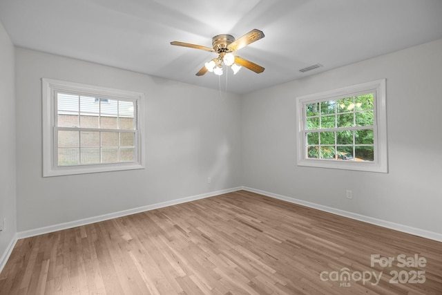 6713 William Harry Ct, Charlotte, NC 28211 - spare room featuring light wood-style floors, baseboards, and a ceiling fan