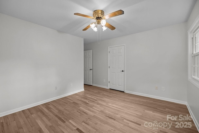 6713 William Harry Ct, Charlotte, NC 28211 - unfurnished room with baseboards, a ceiling fan, and light wood finished floors