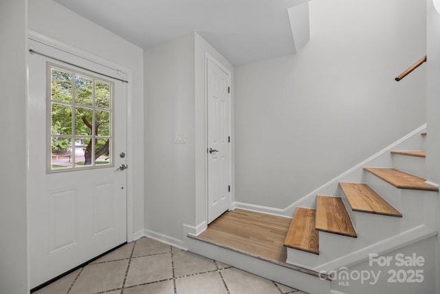 6713 William Harry Ct, Charlotte, NC 28211 - foyer entrance featuring stairway, tile patterned floors, and baseboards