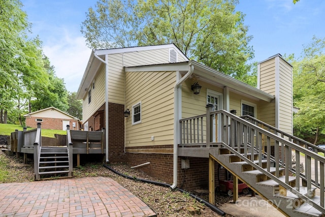 6713 William Harry Ct, Charlotte, NC 28211 - view of side of home featuring stairs, a deck, and a chimney