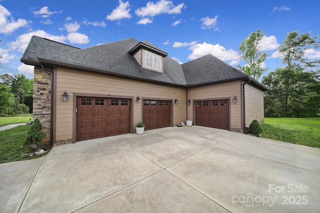 1166 Rocky River Rd, Lancaster, SC 29720 - view of side of property with concrete driveway, an attached garage, roof with shingles, and a lawn