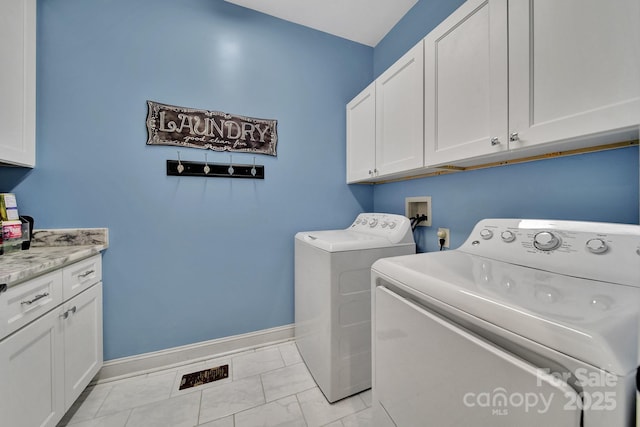 1166 Rocky River Rd, Lancaster, SC 29720 - washroom featuring independent washer and dryer, cabinet space, baseboards, and light marble finish flooring