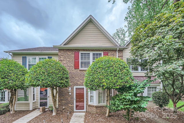townhome / multi-family property with brick siding