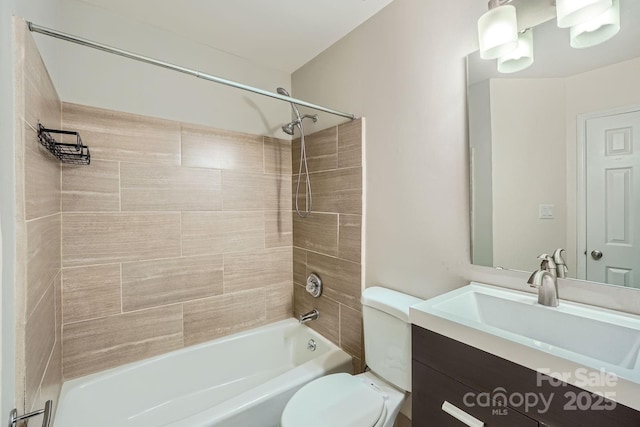 bathroom with toilet, shower / tub combination, and vanity