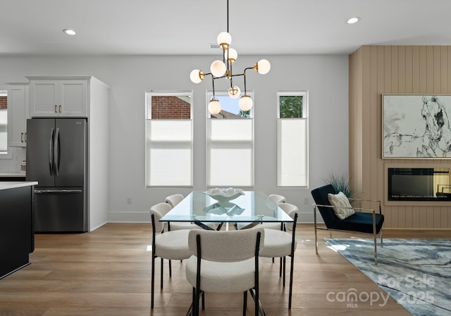 2006 St John St, Charlotte, NC 28216 - dining area featuring light wood-style flooring, recessed lighting, and a chandelier