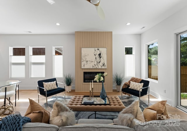 2006 St John St, Charlotte, NC 28216 - living area with light wood-style floors, recessed lighting, and a ceiling fan