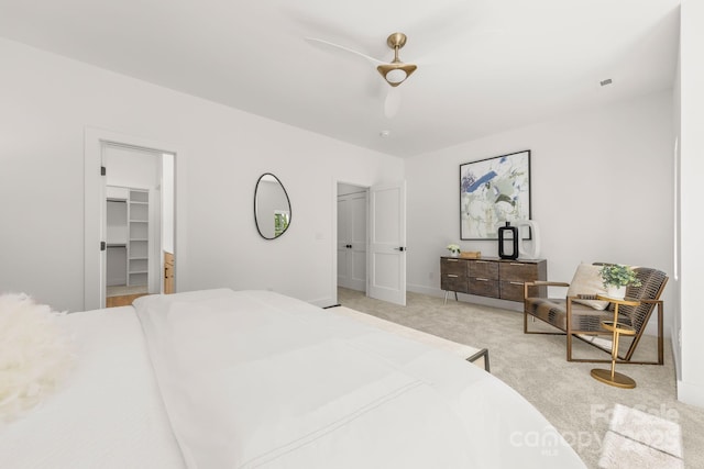 2006 St John St, Charlotte, NC 28216 - bedroom featuring a spacious closet, light colored carpet, and a ceiling fan