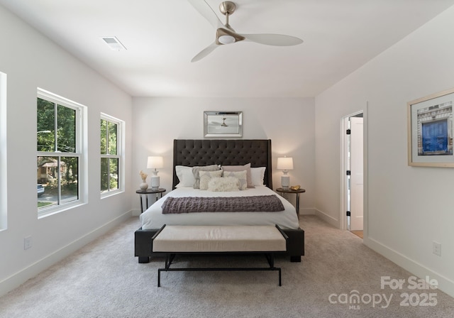 2006 St John St, Charlotte, NC 28216 - carpeted bedroom with baseboards and a ceiling fan