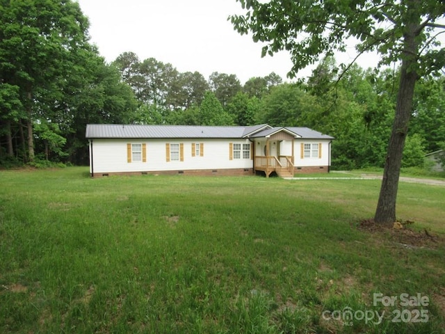 3315 Buffalo Shoals Rd, Newton, NC 28658 - manufactured / mobile home featuring crawl space, a front yard, metal roof, and view of wooded area
