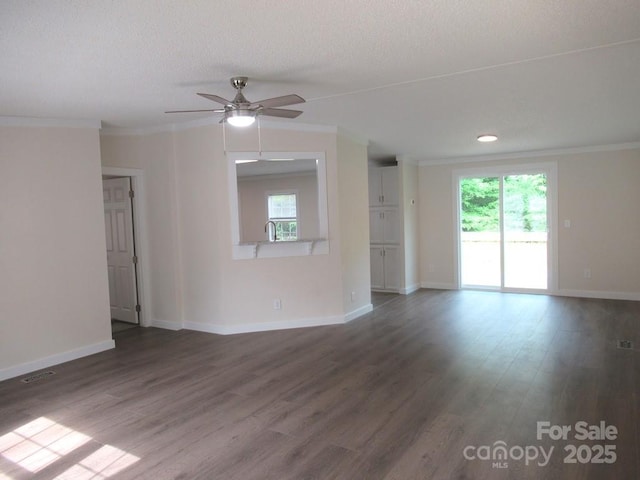 3315 Buffalo Shoals Rd, Newton, NC 28658 - unfurnished living room with crown molding, ceiling fan, baseboards, dark wood-style flooring, and a textured ceiling