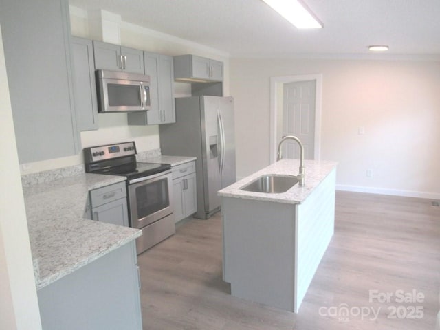 3315 Buffalo Shoals Rd, Newton, NC 28658 - kitchen featuring stainless steel appliances, a sink, gray cabinets, light wood finished floors, and recessed lighting