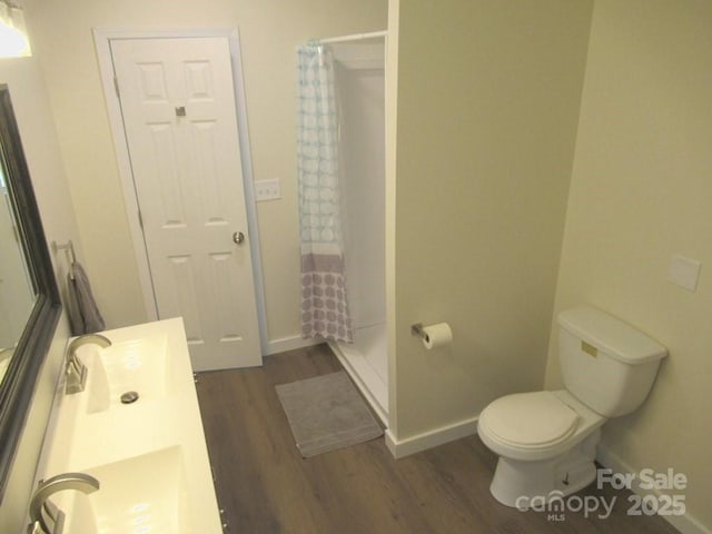 3315 Buffalo Shoals Rd, Newton, NC 28658 - bathroom featuring wood finished floors, a shower with curtain, and toilet