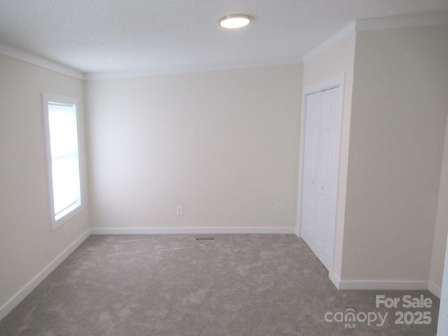 3315 Buffalo Shoals Rd, Newton, NC 28658 - spare room with crown molding, carpet floors, and baseboards