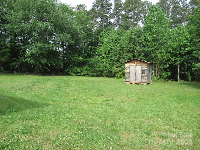 3315 Buffalo Shoals Rd, Newton, NC 28658 - view of green lawn featuring a shed and an outdoor structure