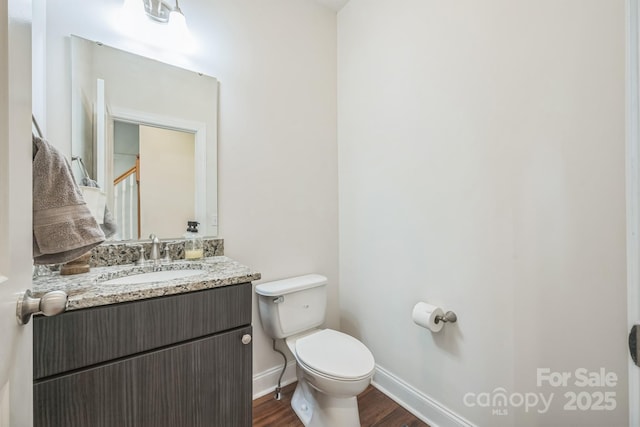 274 Old Bristol Rd, Boone, NC 28607 - bathroom with wood finished floors, toilet, baseboards, and vanity
