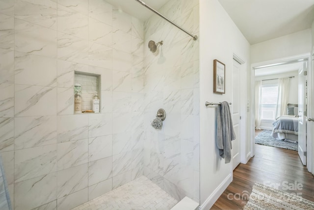 274 Old Bristol Rd, Boone, NC 28607 - ensuite bathroom featuring tiled shower, wood finished floors, and baseboards
